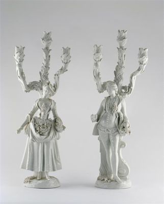 Appraisal: A large pair of French porcelain white-glazed figural candlesticks modelled