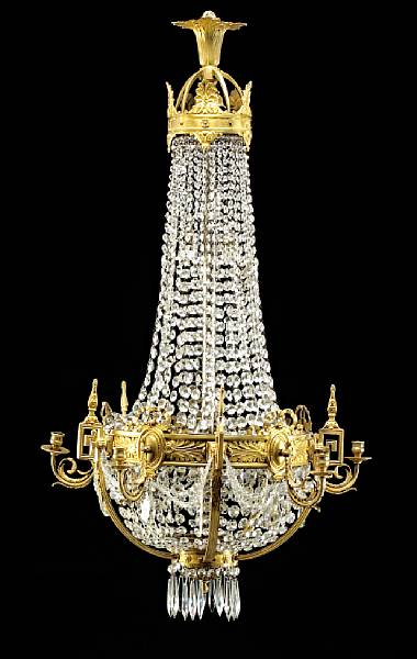 Appraisal: A Neoclassical style gilt bronze and glass five light chandelier