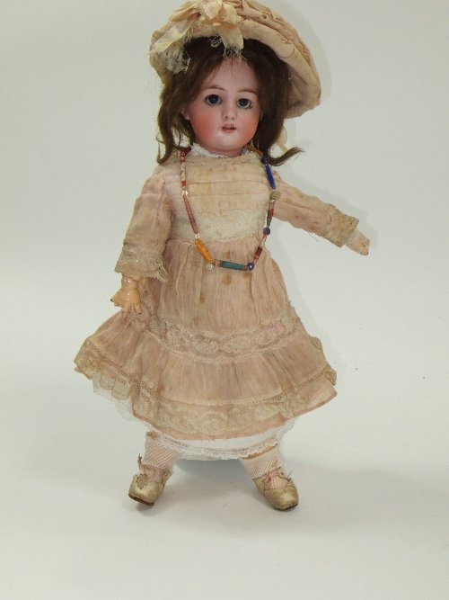 Appraisal: A French bisque head doll with weighted eyes and open