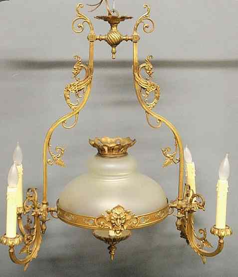 Appraisal: Ornate Victorian brass chandelier with a frosted glass shade dia