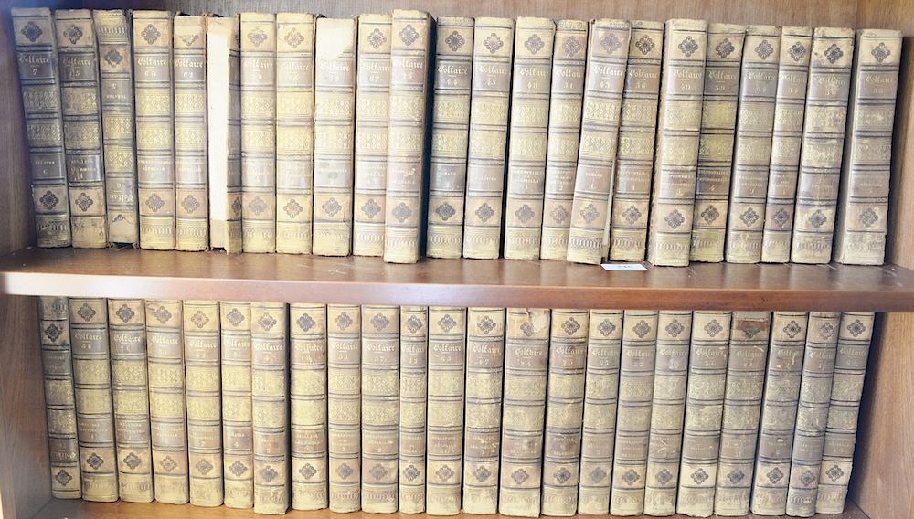 Appraisal: Five shelves of books Oeuvres Completes DeVoltaire volumes of leatherbound