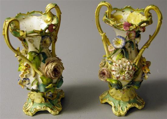 Appraisal: Pair of th century Staffordshire flower encrusted double handled vases