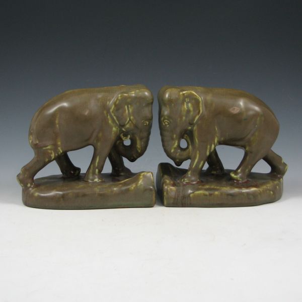 Appraisal: Pair of matte olive green Rookwood elephant bookends from Marked