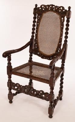 Appraisal: A th Century Franco-Flemish carved walnut armchair with cane back