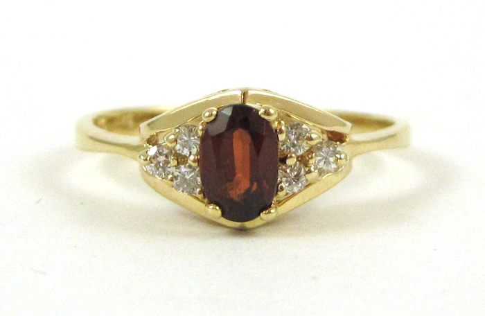 Appraisal: GARNET DIAMOND AND FOURTEEN KARAT GOLD RING with three round-cut