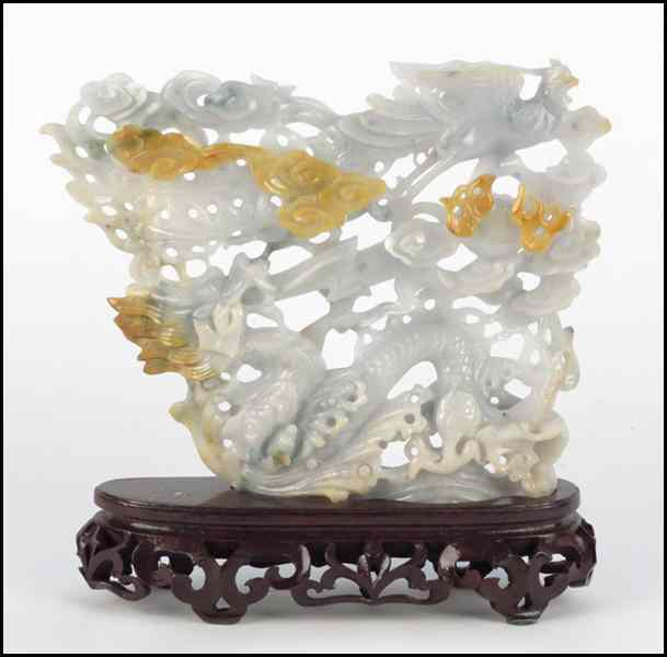 Appraisal: CHINESE CARVED JADE FIGURAL GROUP Depicting a dragon and phoenix