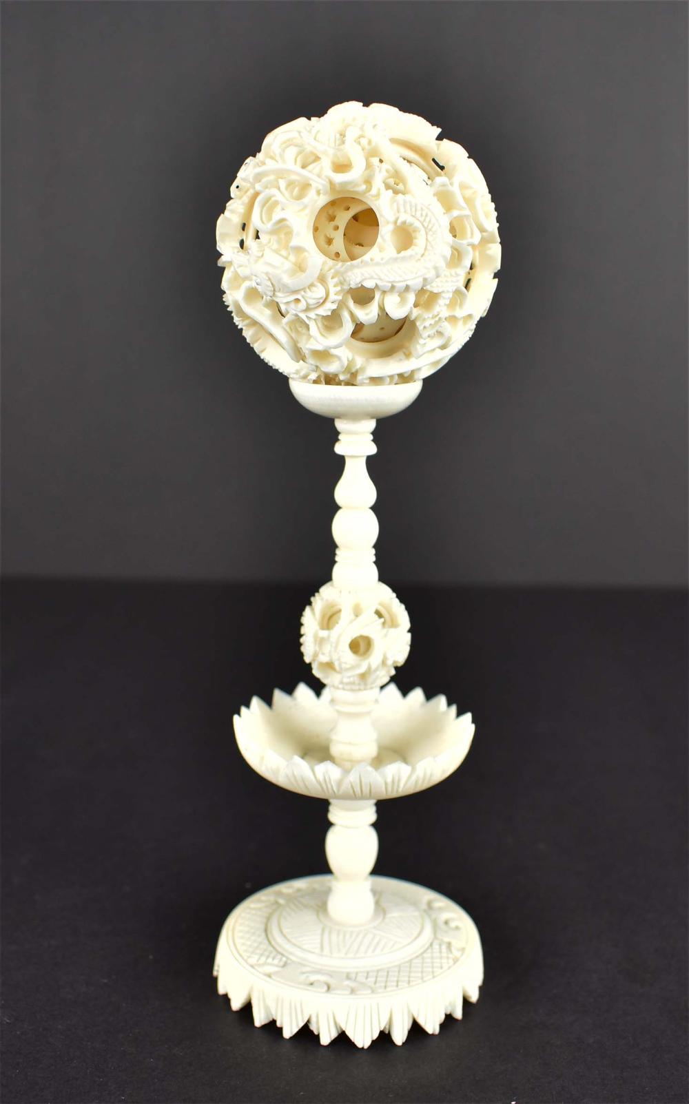 Appraisal: CHINESE CARVED PUZZLE BALL ON STANDCarved as a series of