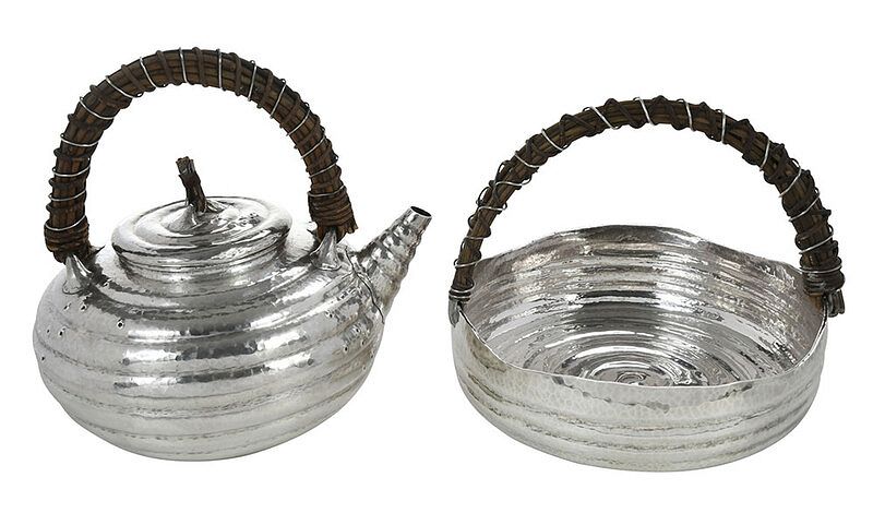 Appraisal: Japanese Hammered Silver Teapot and Basket th century round coil