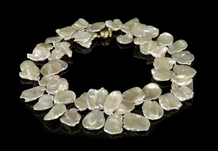 Appraisal: Unusual Strand of Flattened Baroque Keshi Pearls ranging in size