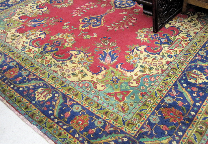 Appraisal: SIGNED PERSIAN TABRIZ CARPET floral and central blue floral medallion