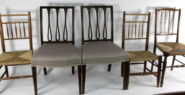 Appraisal: A pair of single chairs shaped and pierced splats to