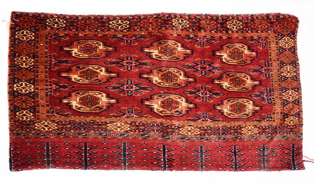 Appraisal: A TURKOMAN KIZIL AYAK JUVAL with three rows of guls