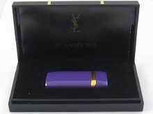 Appraisal: A cigarette lighter by Yves Saint Laurent in original box