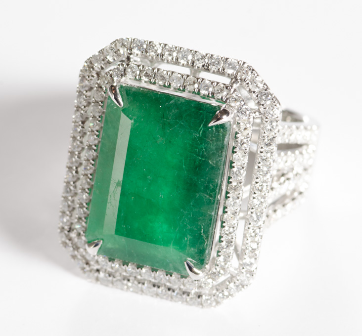 Appraisal: EMERALD DIAMOND AND FOURTEEN KARAT GOLD RING The heavy white