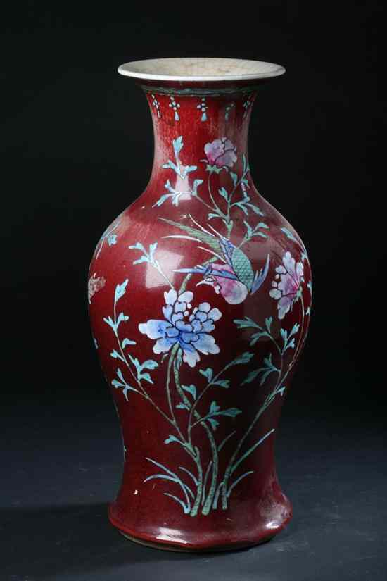 Appraisal: CHINESE COPPER RED AND FAMILLE ROSE PORCELAIN BALUSTER VASE th