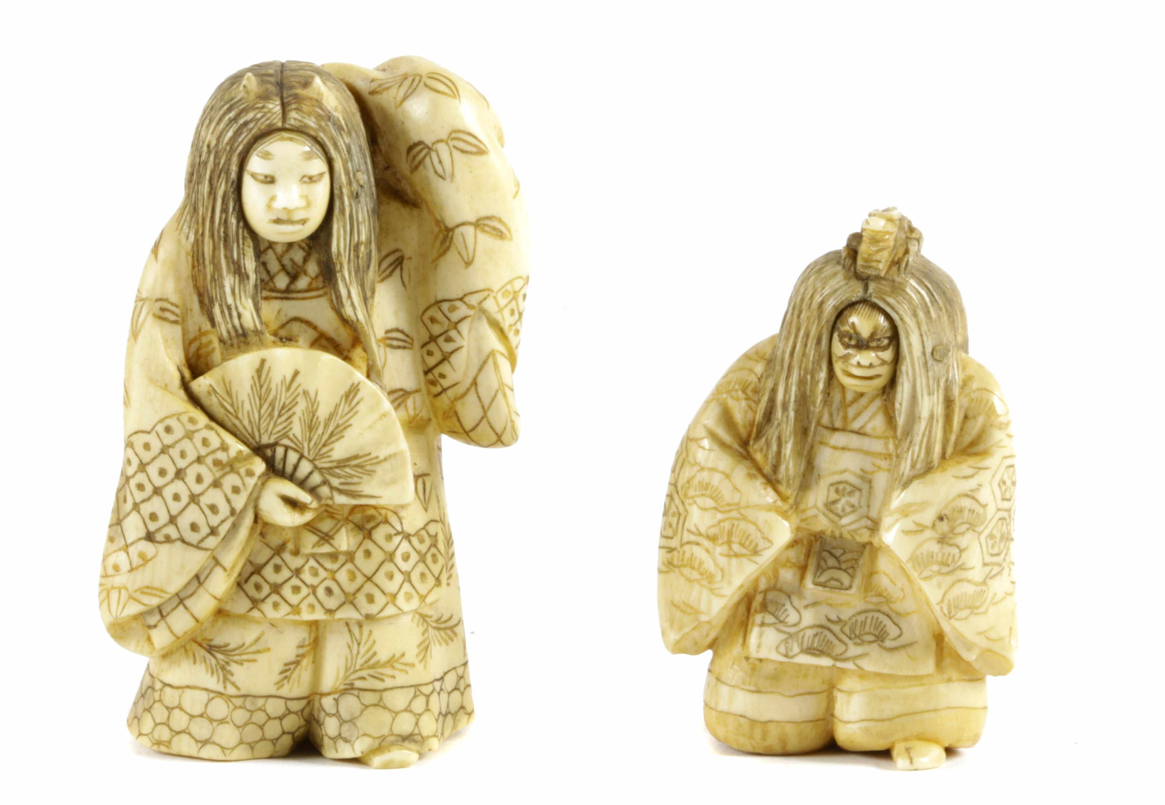 Appraisal: A pair of Japanese ivory 'trick' netsuke of Noh drama