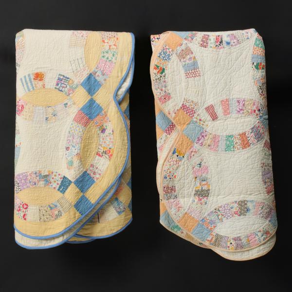 Appraisal: TWO 'DOUBLE WEDDING RING' PATTERN FEEDSACK QUILTSMeasure x and x