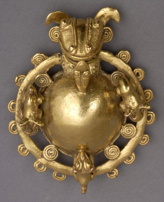 Appraisal: PRE-COLUMBIAN-STYLE GOLD ZOOMORPHIC PENDANT The bull-headed hollow cast center within