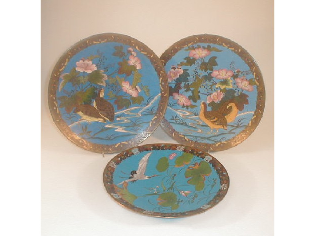 Appraisal: A pair of Chinese cloison chargers decorated with partridge and