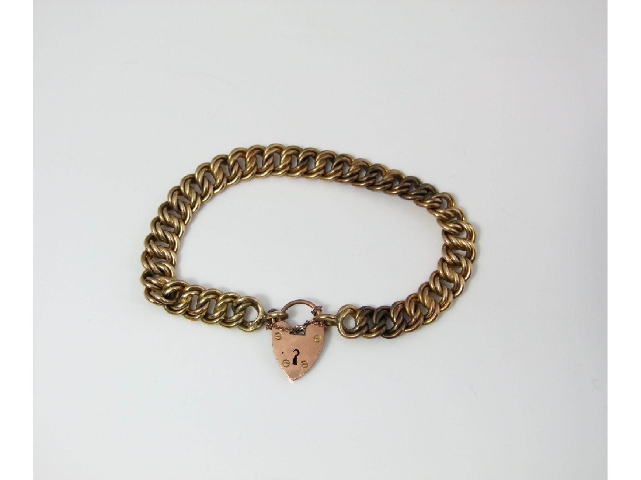 Appraisal: A gold link bracelet with a ct gold padlock clasp