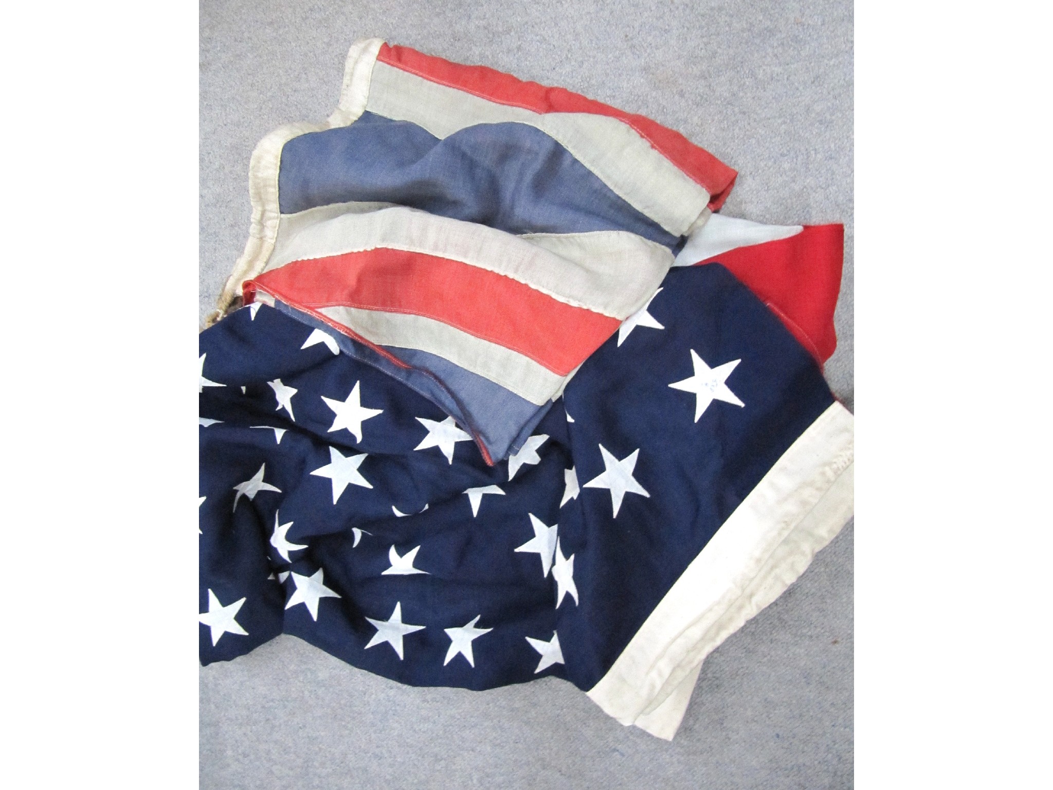 Appraisal: A box of assorted flags - stars and stripes etc