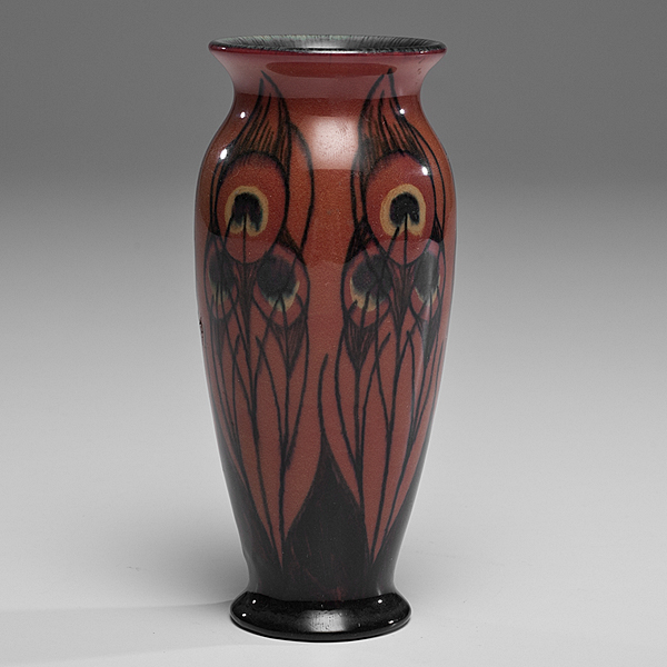 Appraisal: American Cincinnati An Iris glaze vase decorated with peacock feathers