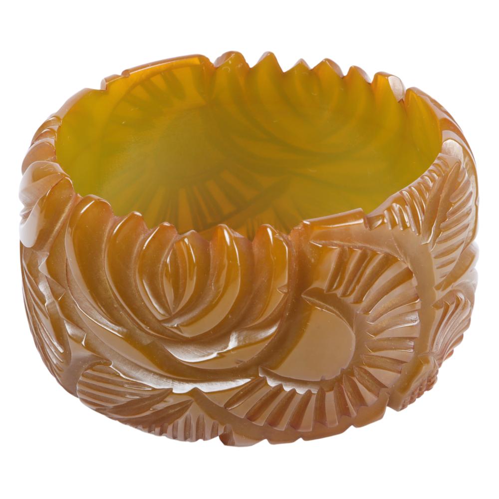 Appraisal: CITRINE BAKELITE WIDE CARVED BANGLE BRACELET WITH LEAF DESIGN INNER