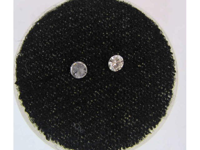 Appraisal: Two round brilliant cut loose diamonds average diameter of mm