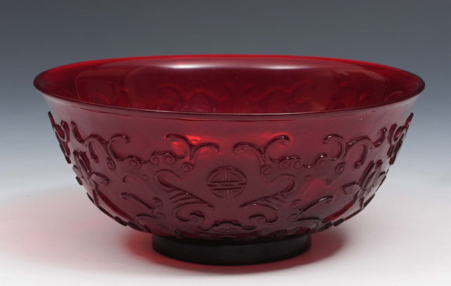 Appraisal: A Chinese red ground Peking glass bowl th Centurythe exterior