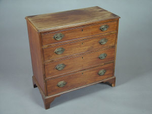 Appraisal: A George III mahogany chest of four long graduated drawers