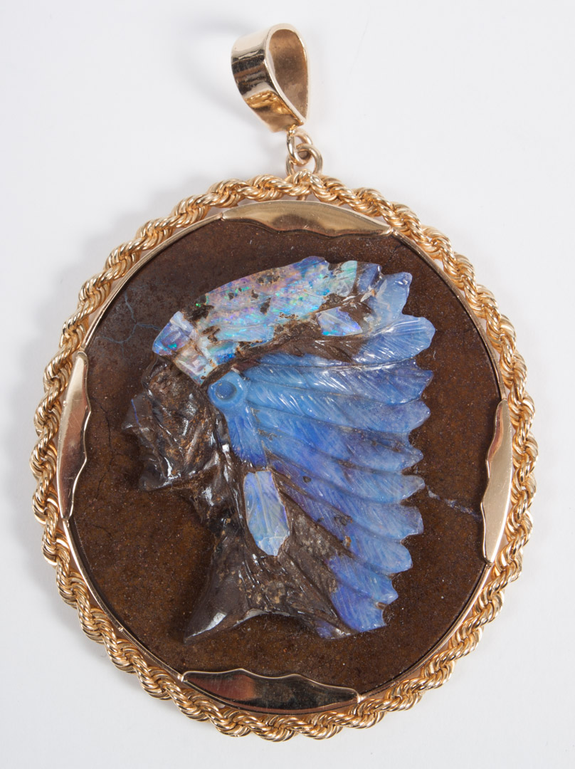 Appraisal: Gold opal matrix cameo portraying a Native American chieftain in