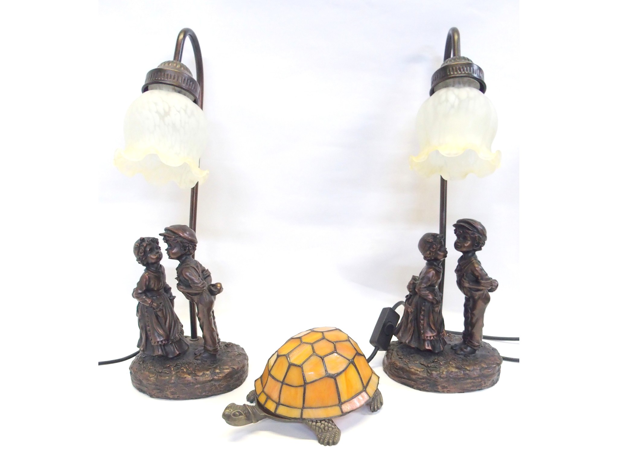 Appraisal: A pair of modern bronzed resin table lamps each modelled