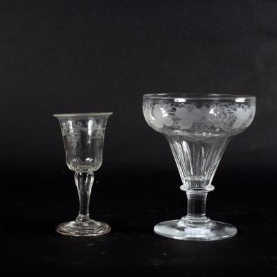 Appraisal: An Edwardian wine glass with trailing fruiting vine decoration on