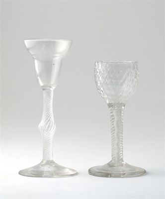 Appraisal: Two wine glasses one with a moulded bowl raised on