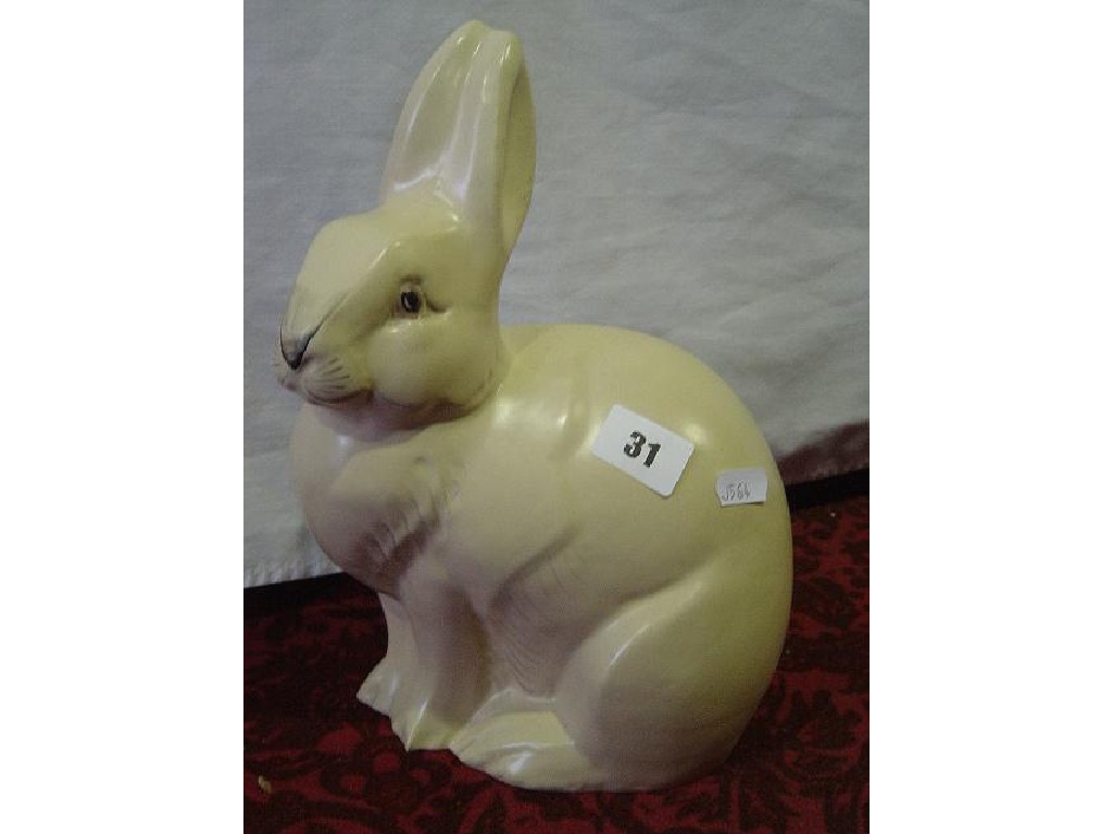 Appraisal: A Grays Pottery buff glazed model of a seated rabbit