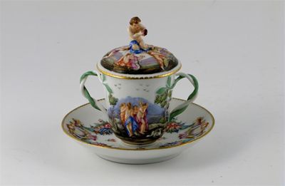 Appraisal: A Doccia-style chocolate cup cover and stand moulded with Classical