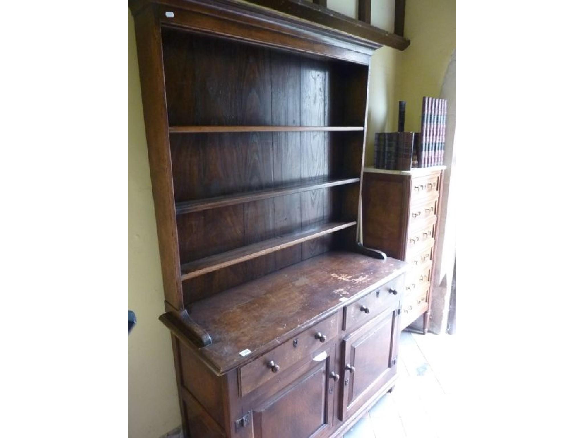 Appraisal: A good quality reproduction oak cottage dresser in the Old