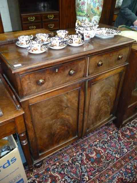 Appraisal: A WILLIAM IV MAHOGANY SIDE CABINET with two drawers over