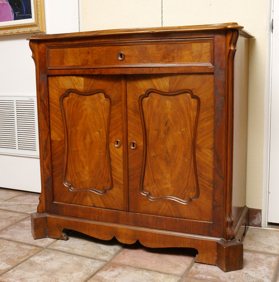 Appraisal: FRENCH WALNUT COMMODE Serpentine overhanging top full length drawer over