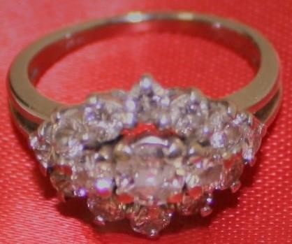 Appraisal: KT WHITE GOLD AND DIAMOND CLUSTER RING APPROXIMATELY POINT CENTER