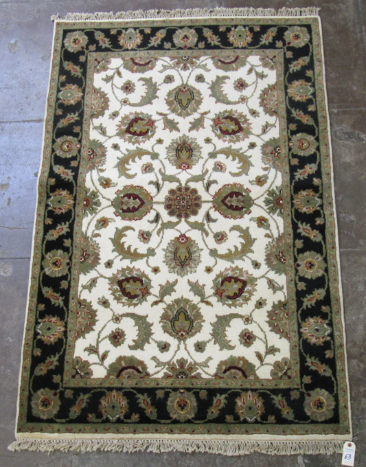 Appraisal: ORIENTAL AREA RUG Indo-Persian hand knotted in an overall floral