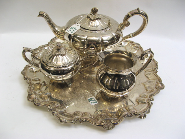 Appraisal: SILVER PLATED TEA SET ROUND SERVICE TRAY the tea set