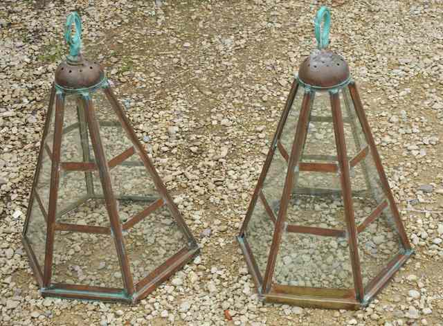 Appraisal: A PAIR OF OLD COPPER HEXAGONAL CLOCHES with glazed sides