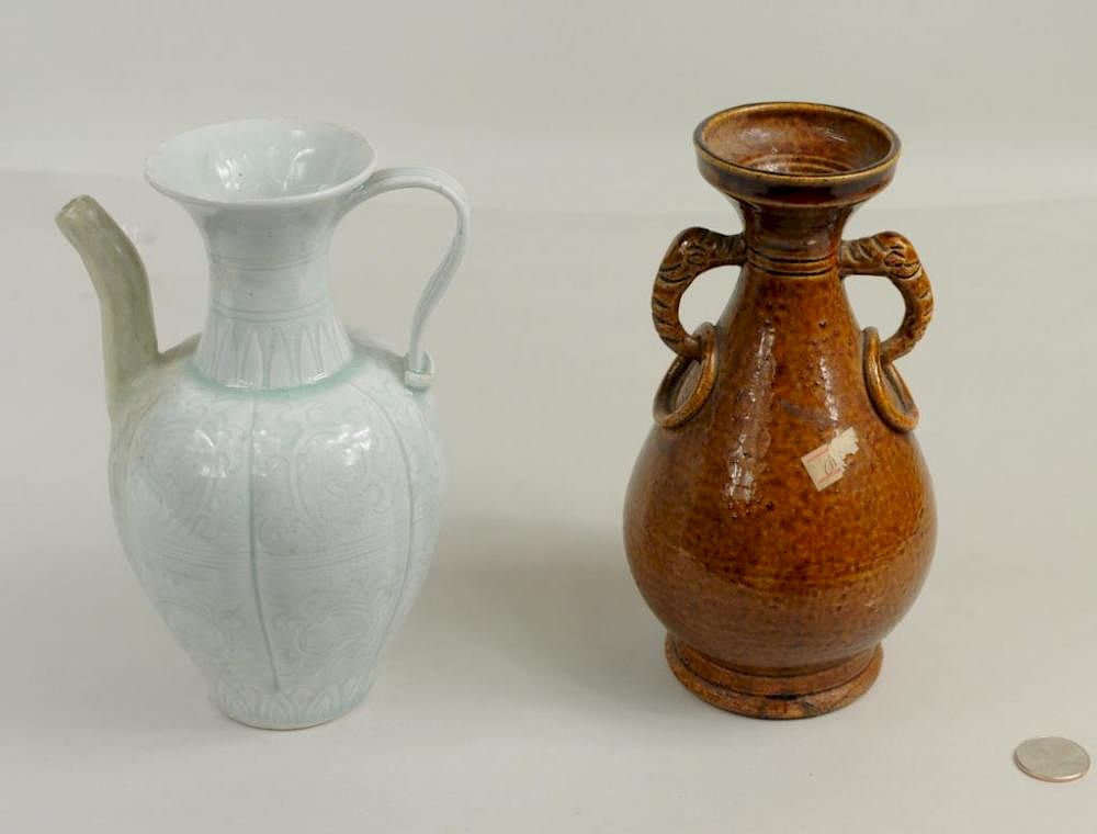 Appraisal: Two Chinese Pottery Containers Two Chinese pottery containers comprising a