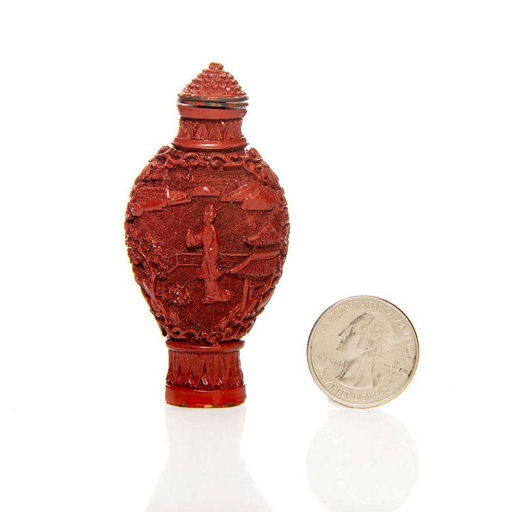 Appraisal: VINTAGE HAND CARVED CINNABAR CHINESE SNUFF BOTTLE Garden scene on