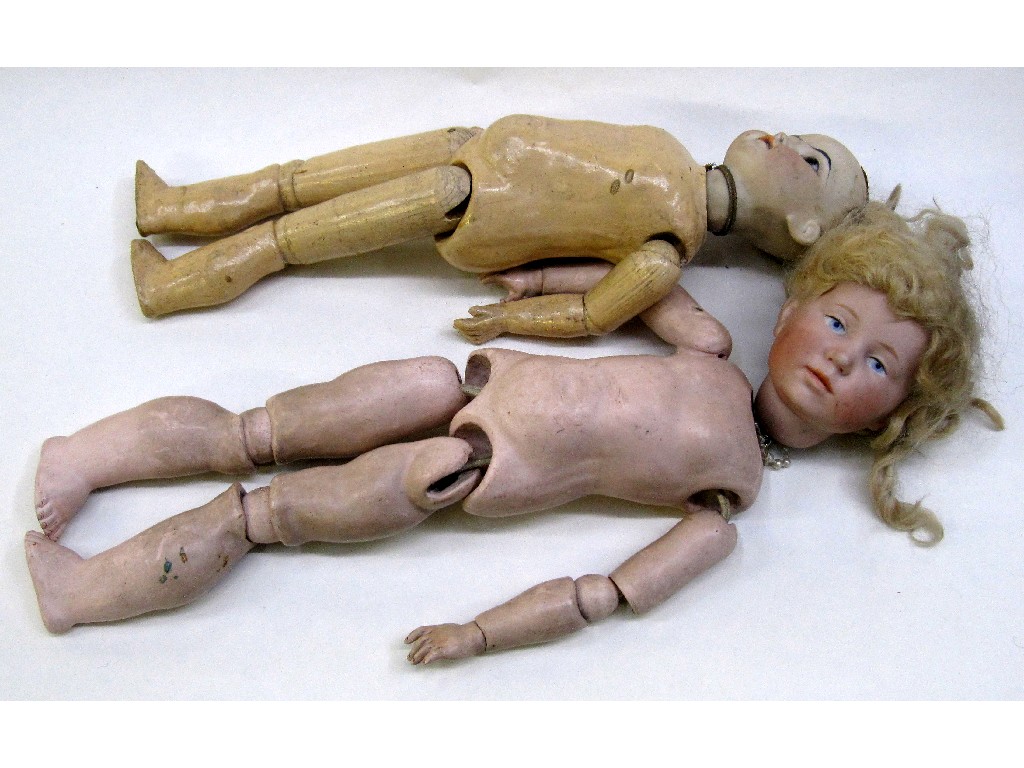 Appraisal: Lot comprising two bisque headed dolls with articulated bodies