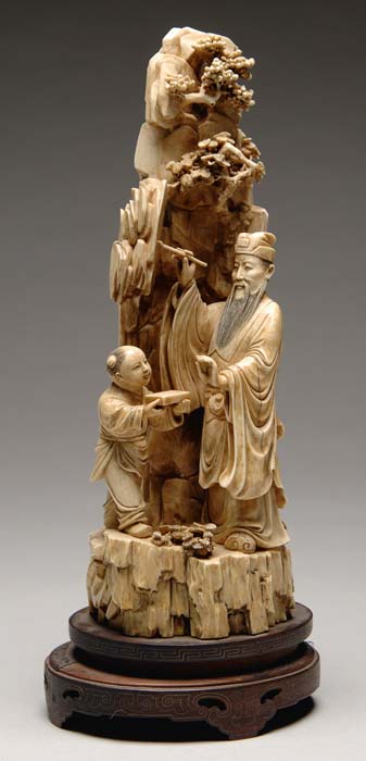 Appraisal: OUTSTANDING CARVED IVORY FIGURAL GROUP OF AN ARTIST One piece