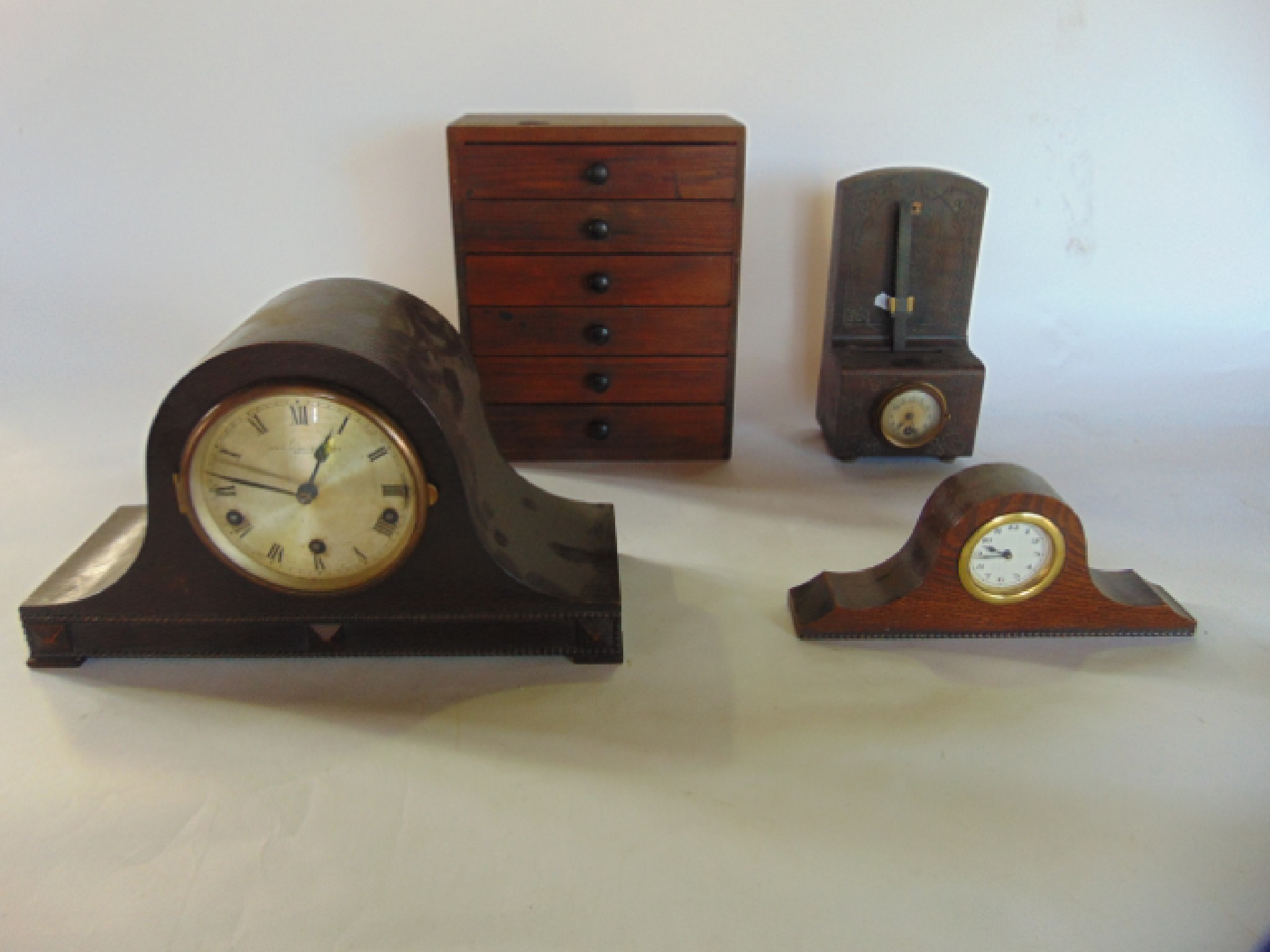 Appraisal: A 's oak cased mantel clock with three train movement