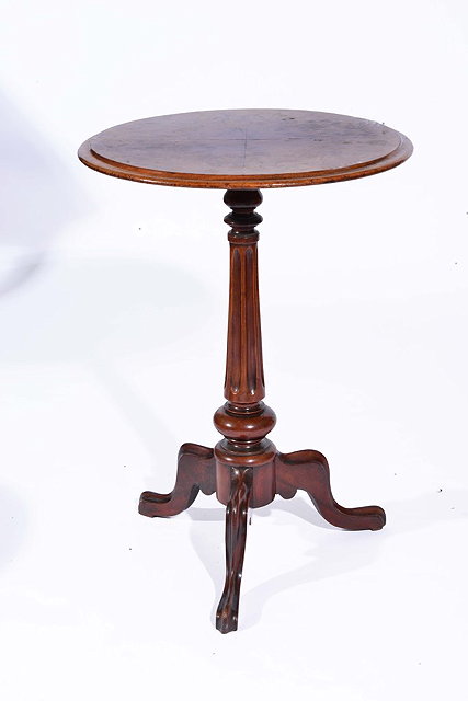 Appraisal: A VICTORIAN WALNUT CIRCULAR OCCASIONAL TABLE on fluted column and