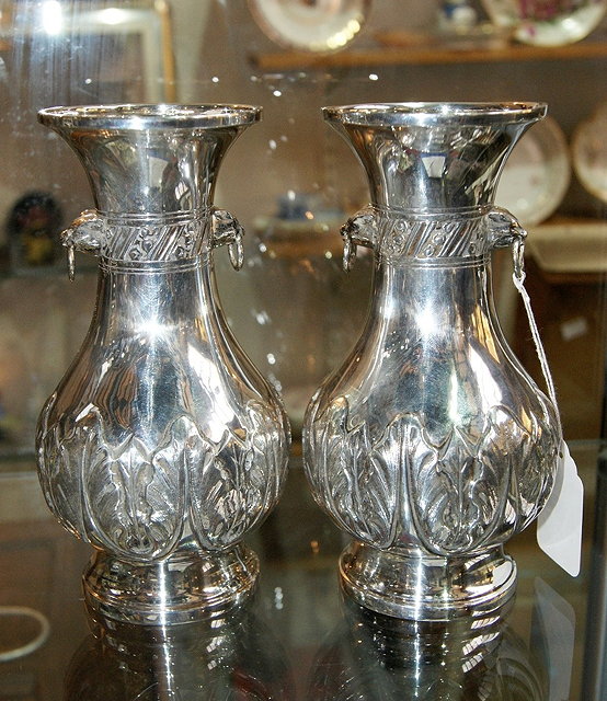 Appraisal: Pair of silver vasesof baluster form with embossed geometric decoration